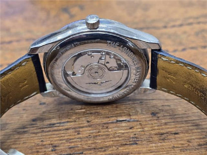 Longines Master Collection watch with boxed papers, featuring a classic design and stainless steel case.