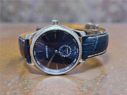 Longines Master Collection watch with boxed papers, featuring a classic design and stainless steel case.