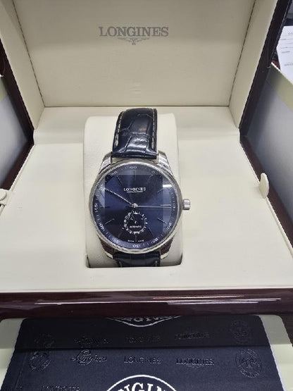 Longines Master Collection watch with boxed papers, featuring a classic design and stainless steel case.
