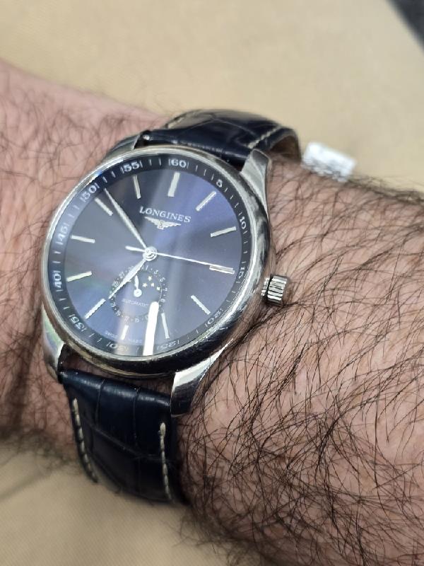 Longines Master Collection watch with boxed papers, featuring a stainless steel case and classic dial design.