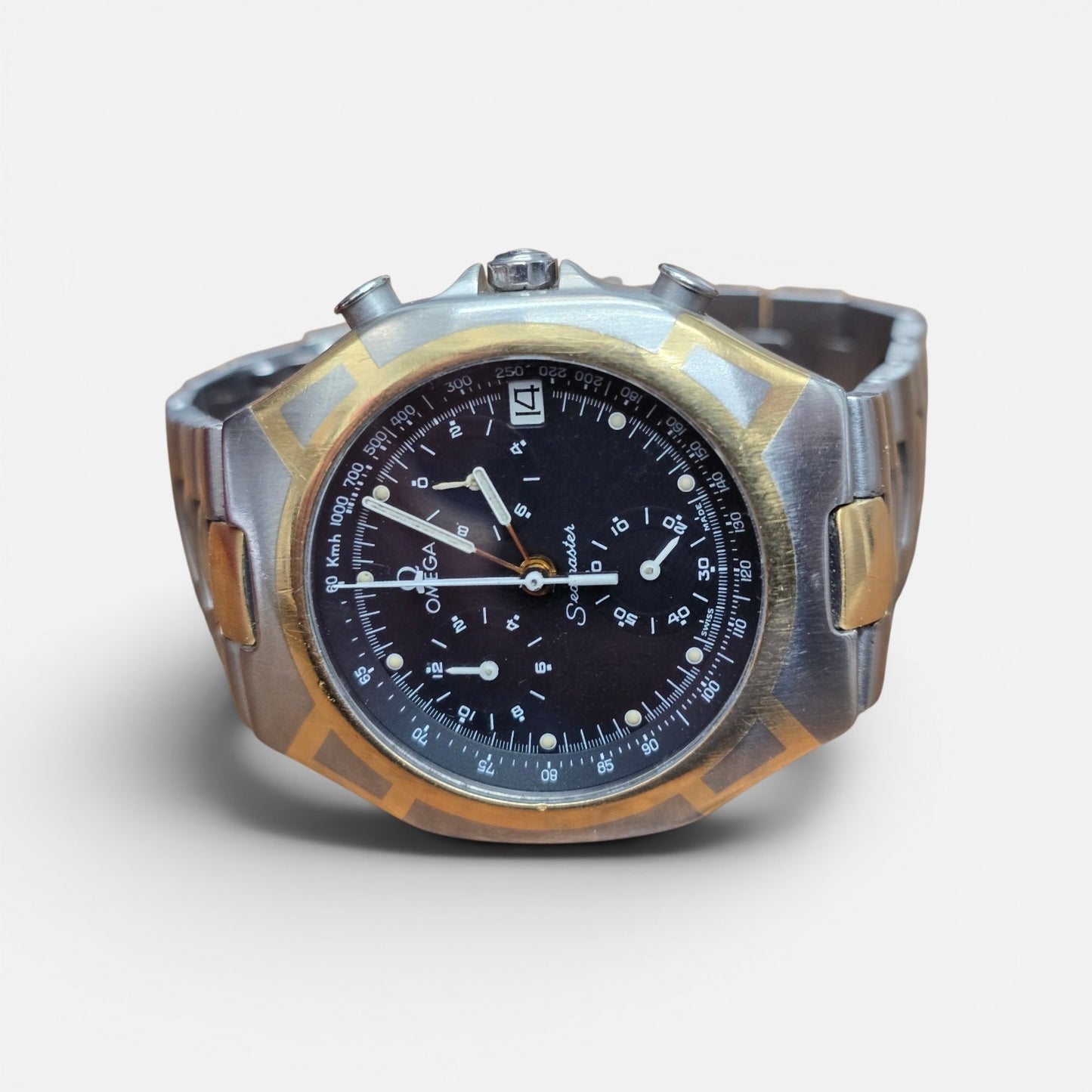 Omega Seamaster Polaris Chronograph watch with box and card, featuring a stainless steel case and detailed chronograph dial.