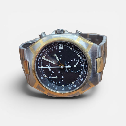 Omega Seamaster Polaris Chronograph watch with box and card, featuring a stainless steel case and detailed chronograph dial.