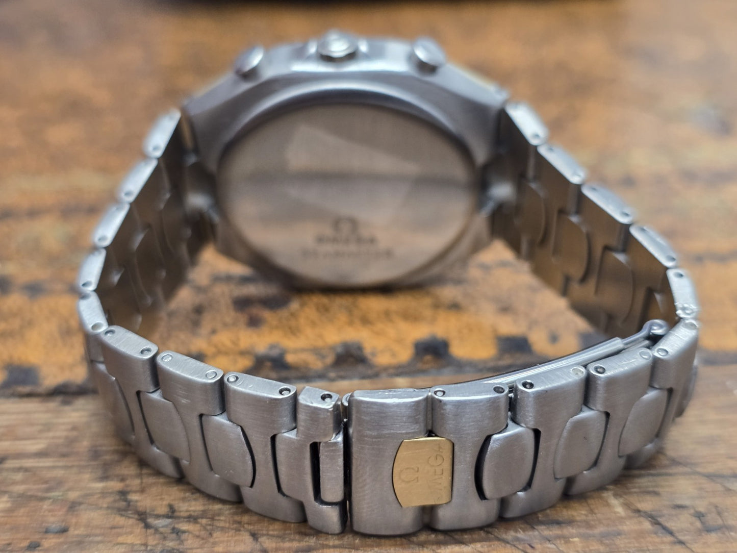 Omega Seamaster Polaris Chronograph watch with boxed packaging and authenticity card, stylish stainless steel timepiece.