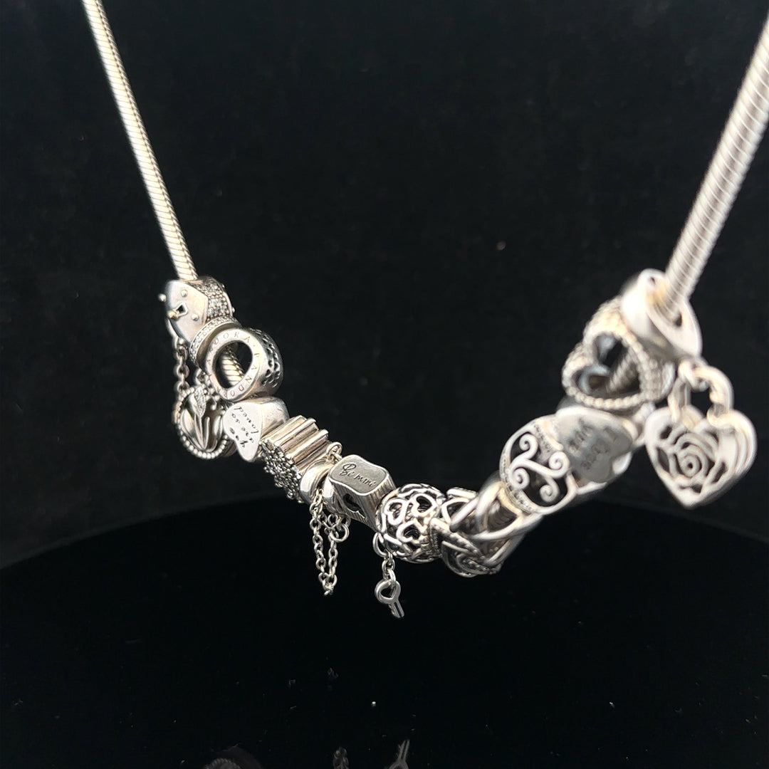 Pandora charm necklace, 20-inch chain, silver-tone jewelry with intricate design and clasp, showcasing elegant craftsmanship.