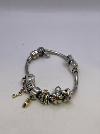 Silver Pandora bracelet weighing 42.3g with intricate links, showcasing a stylish and elegant jewelry piece.