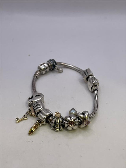Silver Pandora bracelet weighing 42.3g with intricate links, showcasing a stylish and elegant jewelry piece.