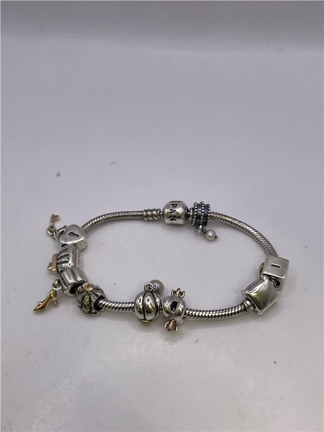 Silver Pandora bracelet weighing 42.3 grams with intricate design, showcasing a stylish and elegant jewelry piece.