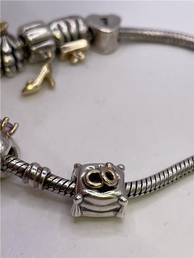 Silver Pandora bracelet weighing 42.3 grams, featuring a sleek design with intricate detailing, perfect for stylish accessories.