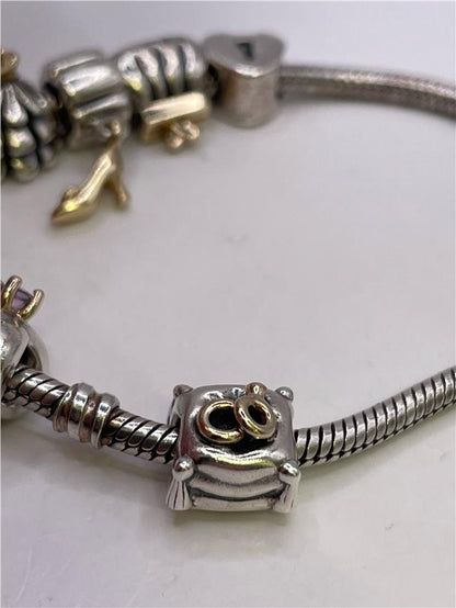 Silver Pandora bracelet weighing 42.3 grams, featuring a sleek design with intricate detailing, perfect for stylish accessories.