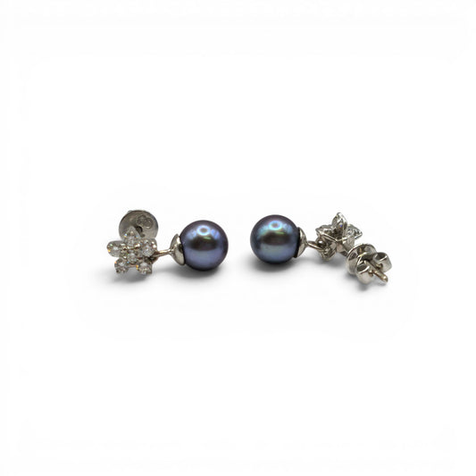 18ct white gold diamond and pearl earrings by Reeves and Sons, featuring elegant pearl drops with sparkling diamonds.