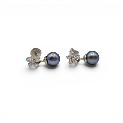Reeves and Sons 18ct white gold diamond and pearl earrings, featuring elegant pearl drops and sparkling diamonds.