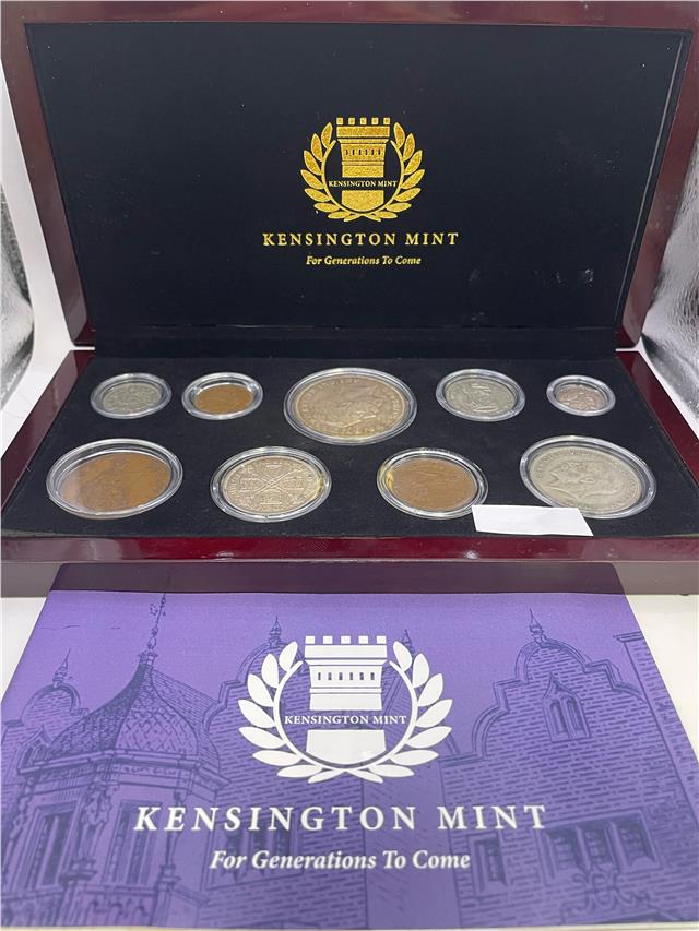 1935 silver Jubilee silver coin set by Reeves and Sons, featuring commemorative coins with intricate designs.