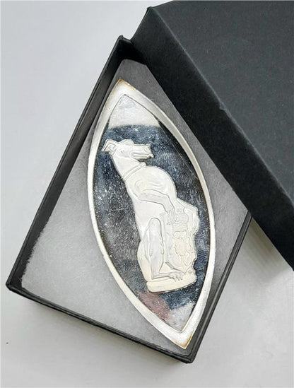 Silver coin from Reeves and Sons, The Queen's Beasts silver ingot with intricate design and detailed engravings.