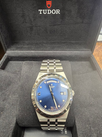 Reeves and Sons Tutor Royal Day Date Diamond Watch Model 28600 with gold case and diamond accents, 2021 design.
