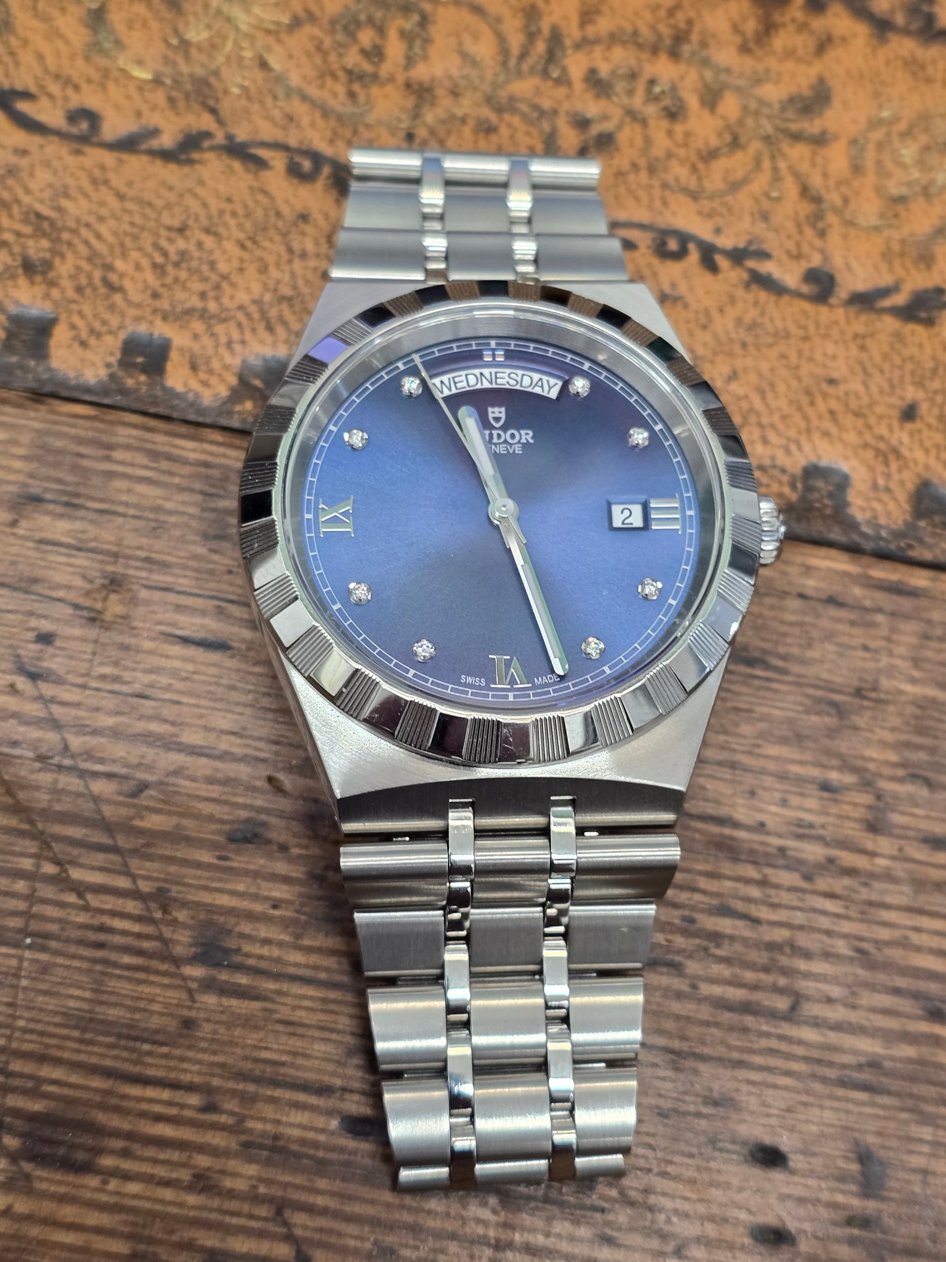 Reeves and Sons Tutor Royal Day Date Diamond Watch model 28600 with gold-tone case and white dial, 2021.