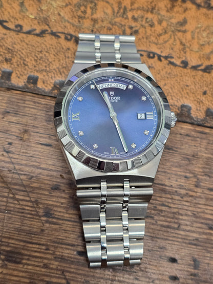 Reeves and Sons Tutor Royal Day Date Diamond Watch model 28600 with gold-tone case and white dial, 2021.