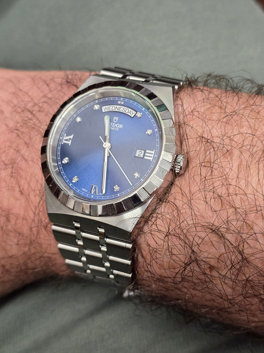 Reeves and Sons Tutor Royal Day Date Diamond Watch model 28600 with gold case and diamond accents, 2021 design.