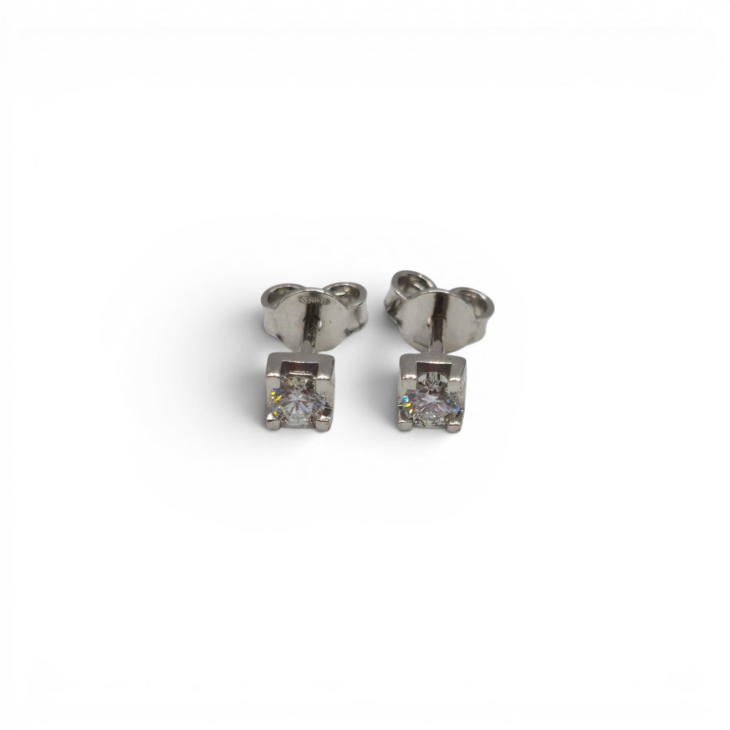 18ct white gold diamond stud earrings by Reeves and Sons, featuring sparkling diamonds in a classic design.