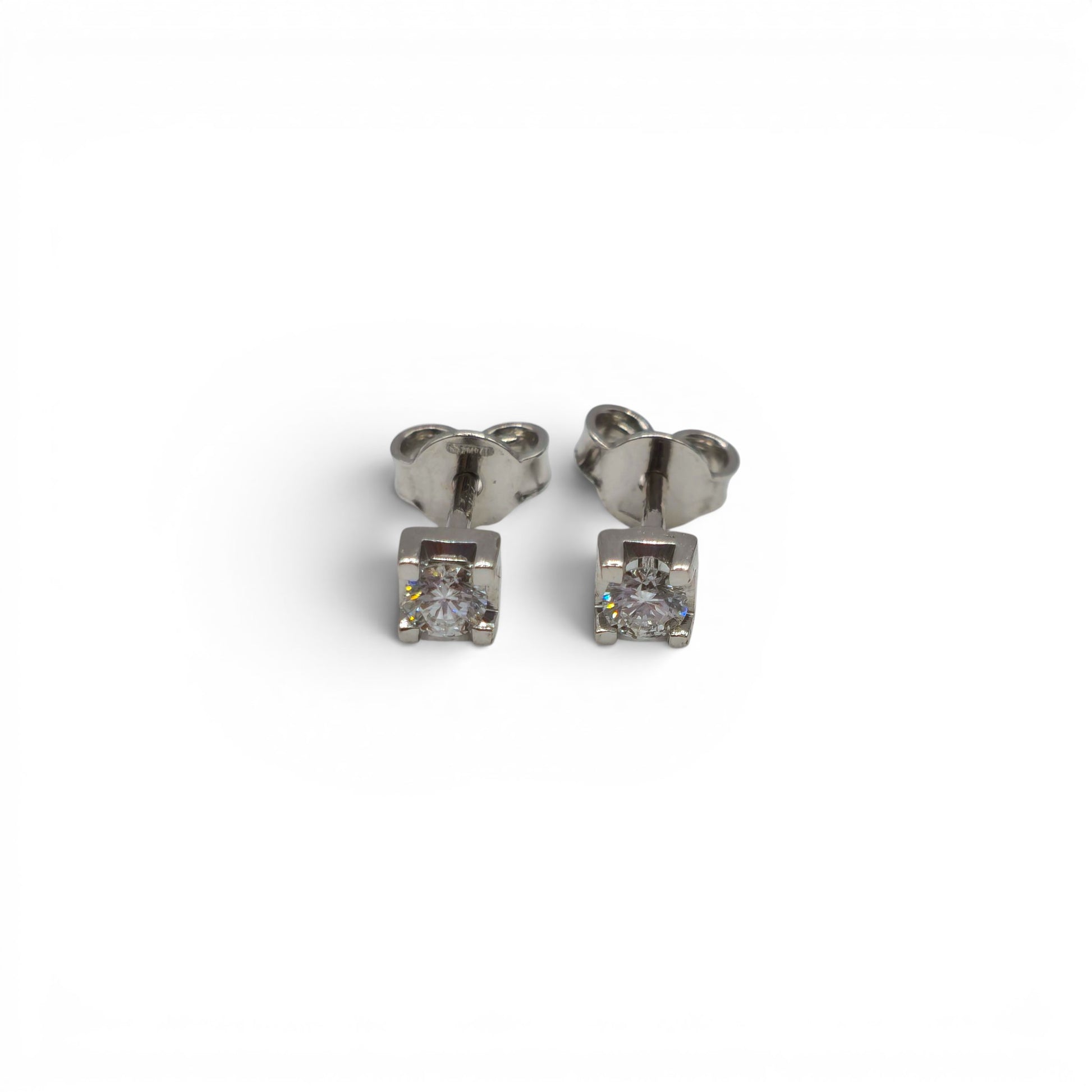 18ct white gold diamond stud earrings by Reeves and Sons, featuring sparkling diamonds in a classic design.