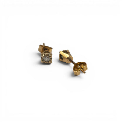 9ct yellow gold diamond stud earrings by Reeves and Sons, featuring sparkling diamonds set in classic gold setting.