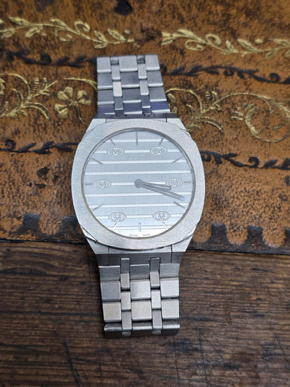 Reeves and Sons Ladies Gucci watch box with paper, elegant packaging for women's luxury watch storage and presentation.