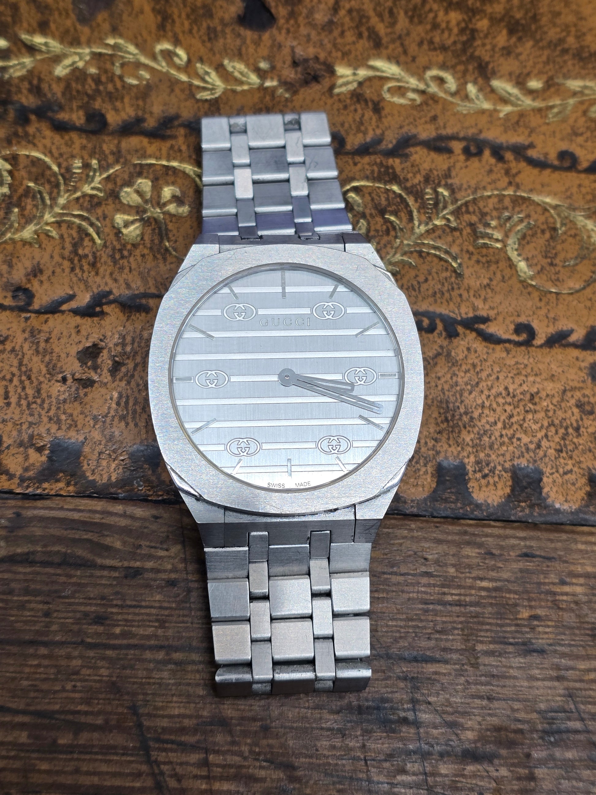 Reeves and Sons ladies Gucci watch box with paper, featuring a sleek design for storing and protecting women's watches.