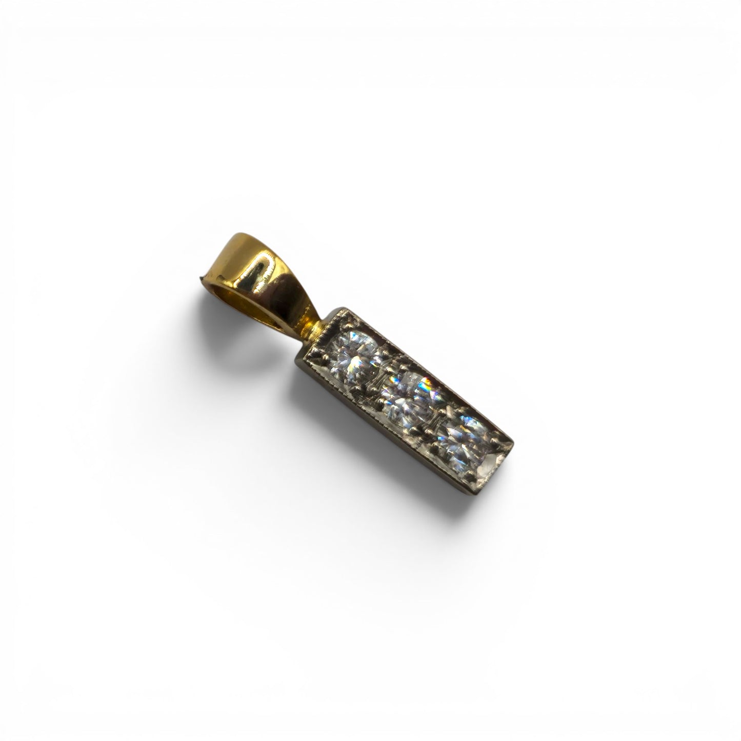 18ct yellow gold diamond 3-stone pendant by Reeves and Sons featuring sparkling diamonds in a classic design.