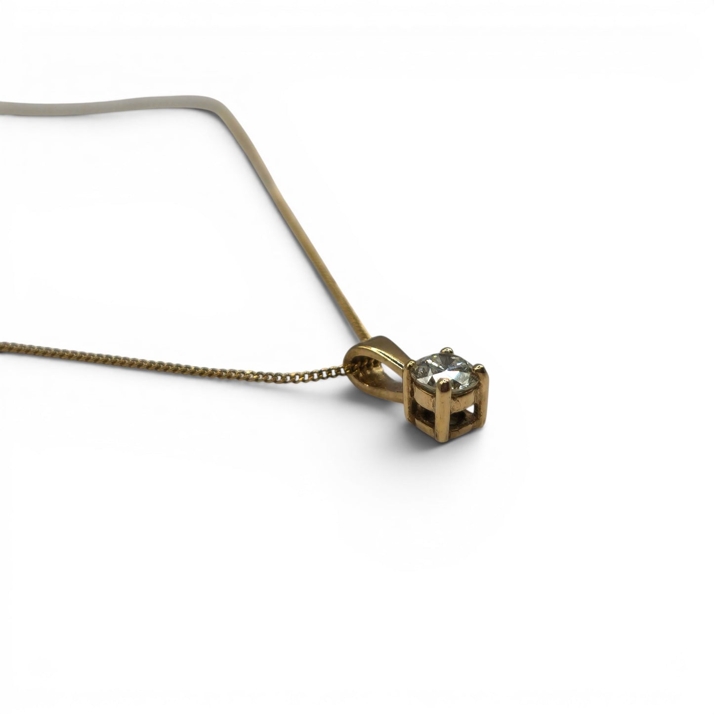9ct yellow gold chain with diamond pendant from Reeves and Sons, featuring a sparkling 0.25 carat diamond.