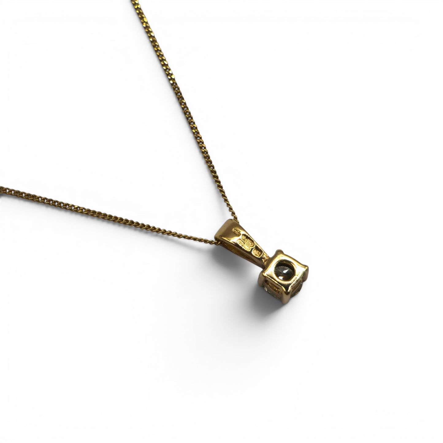 9ct yellow gold chain with diamond pendant featuring 0.25 carats of diamonds from Reeves and Sons, showcasing the elegant jewelry piece.