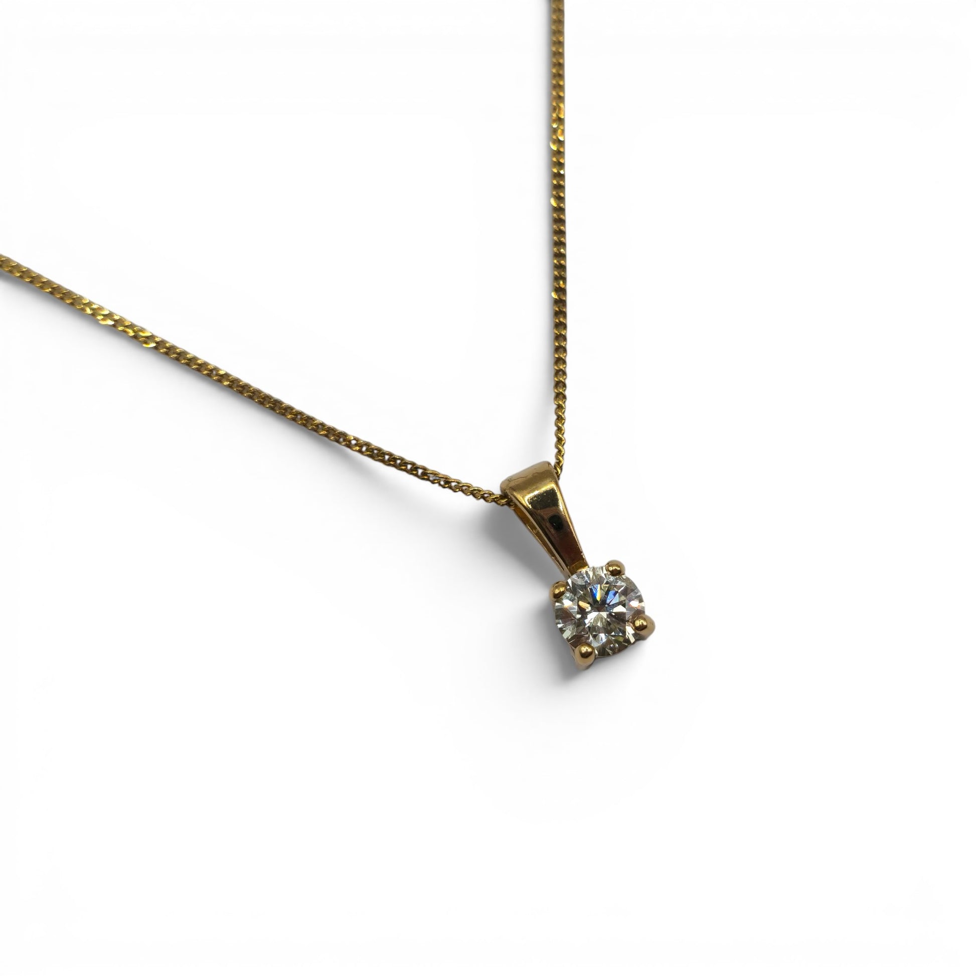 Reeves and Sons 9ct yellow gold chain with 0.25 carat diamond pendant, elegant jewelry featuring gold and sparkling diamond.