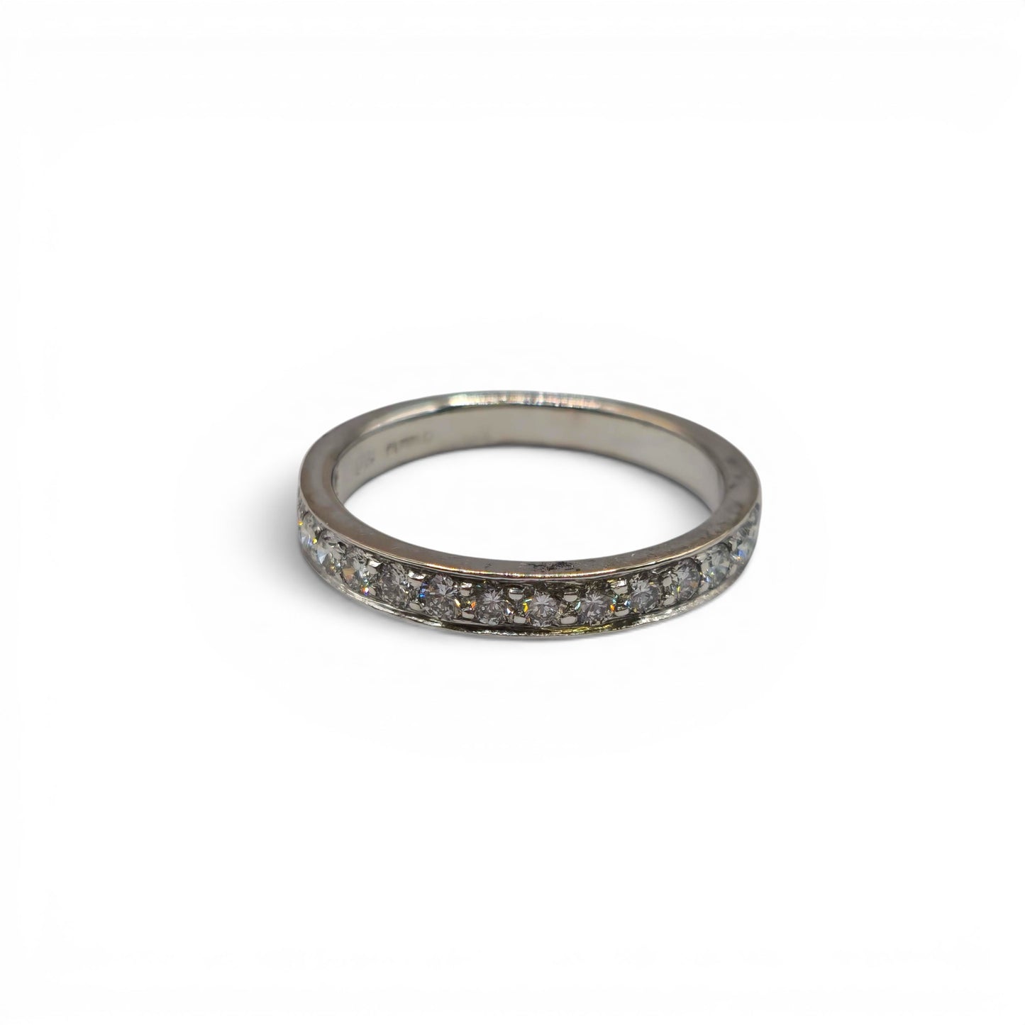 18ct white gold half eternity diamond ring by Reeves and Sons, showcasing sparkling diamonds around the band.