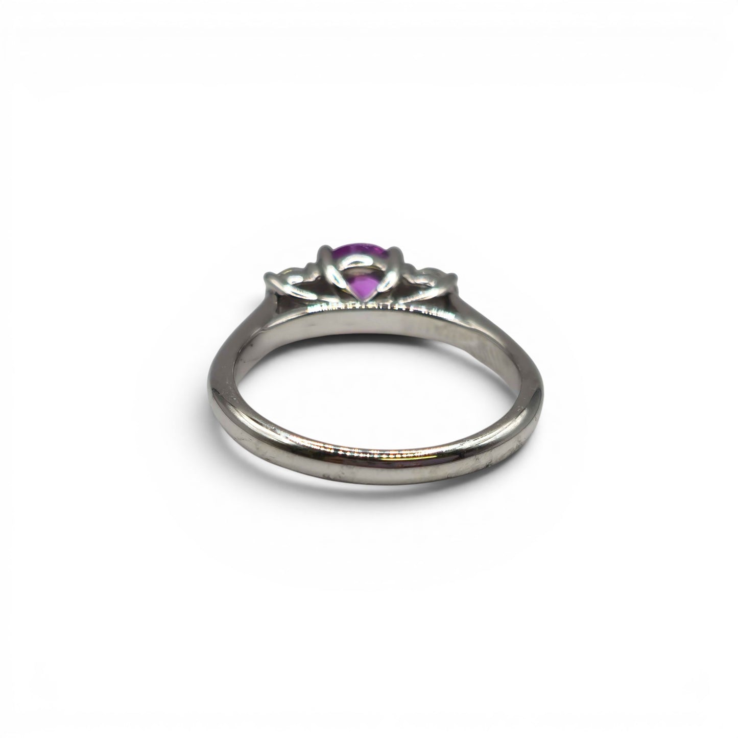 18ct white gold pink sapphire and diamond ring by Reeves and Sons, featuring a pink sapphire centerpiece with diamond accents.