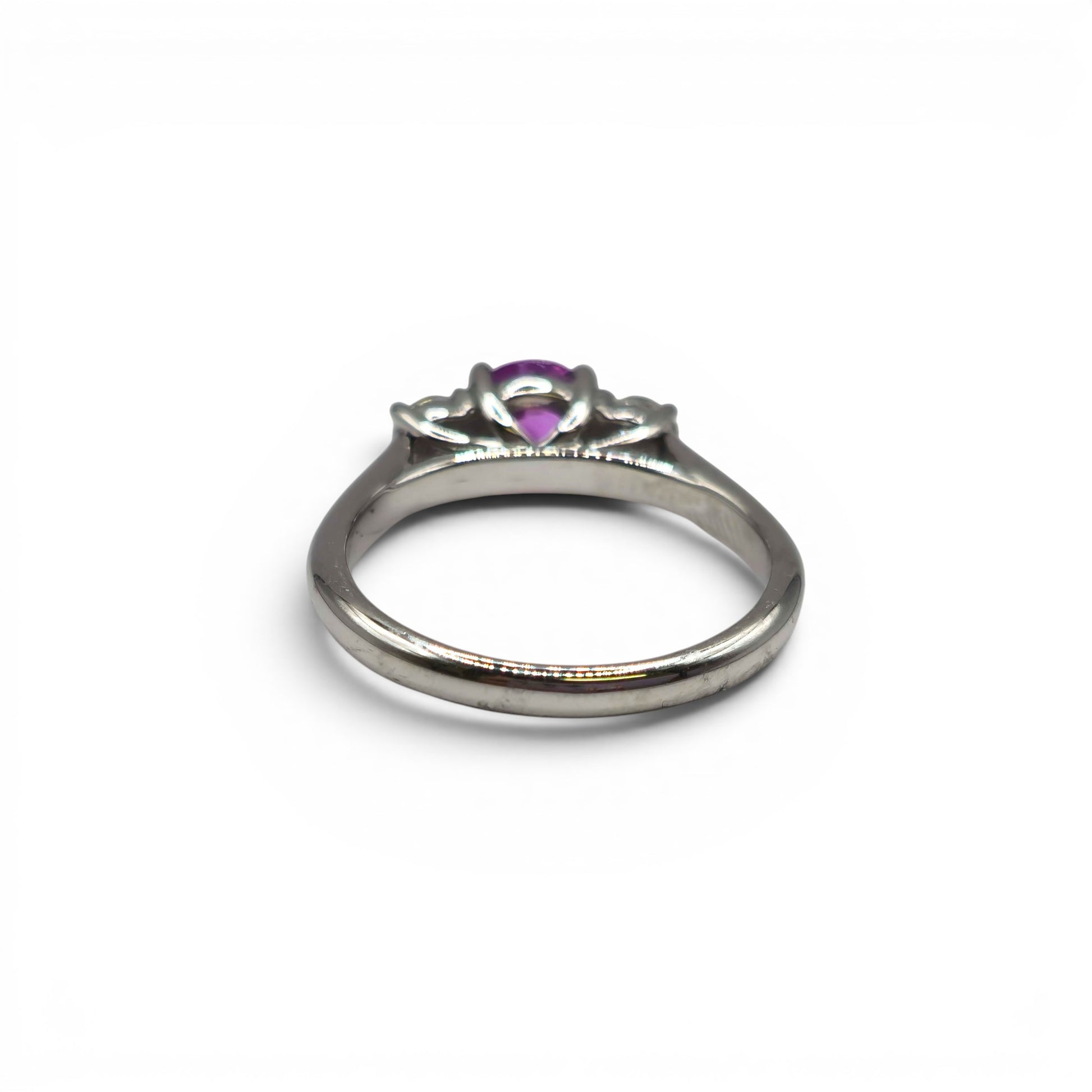 18ct white gold pink sapphire and diamond ring by Reeves and Sons, featuring a pink sapphire centerpiece with diamond accents.