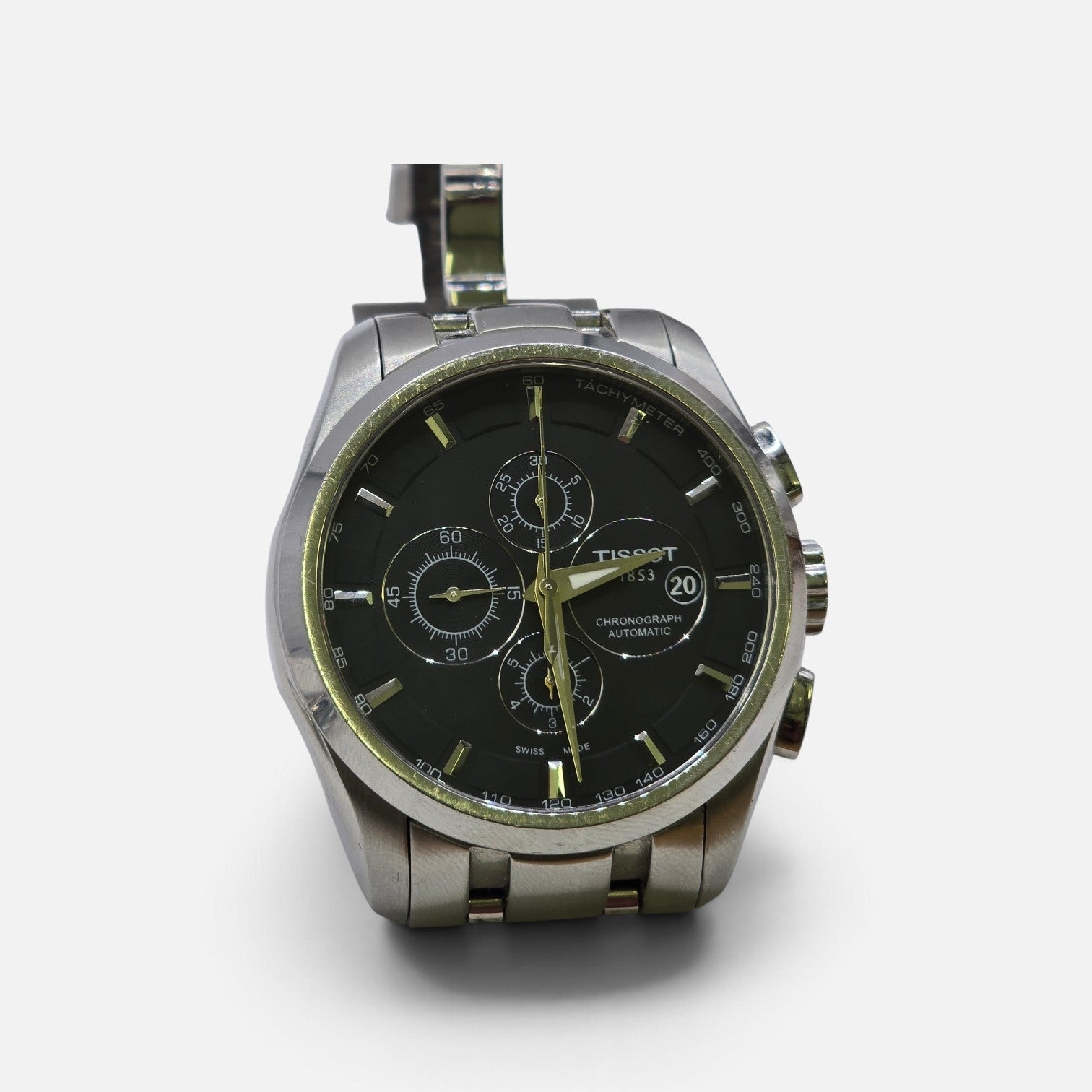 Tissot 1853 automatic chronograph watch with black dial and stainless steel bracelet, showcasing a sleek, modern design.