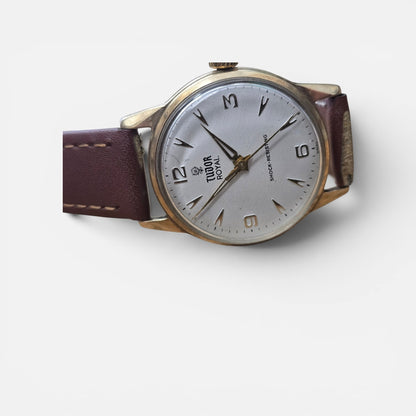 9ct yellow gold Tudor Royal watch with a brown leather strap, featuring a classic round dial and elegant design.