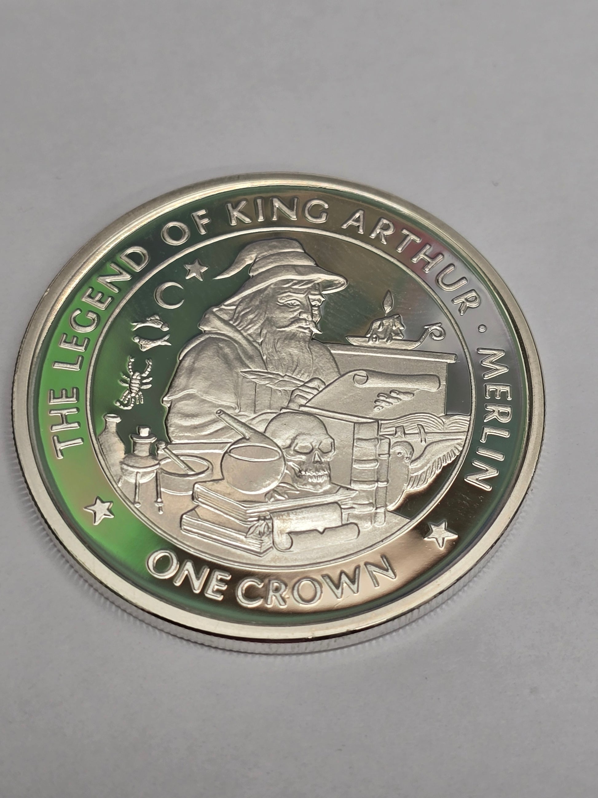 Silver King Arthur coin featuring a crown design, showcasing detailed engravings and the Reeves and Sons branding.