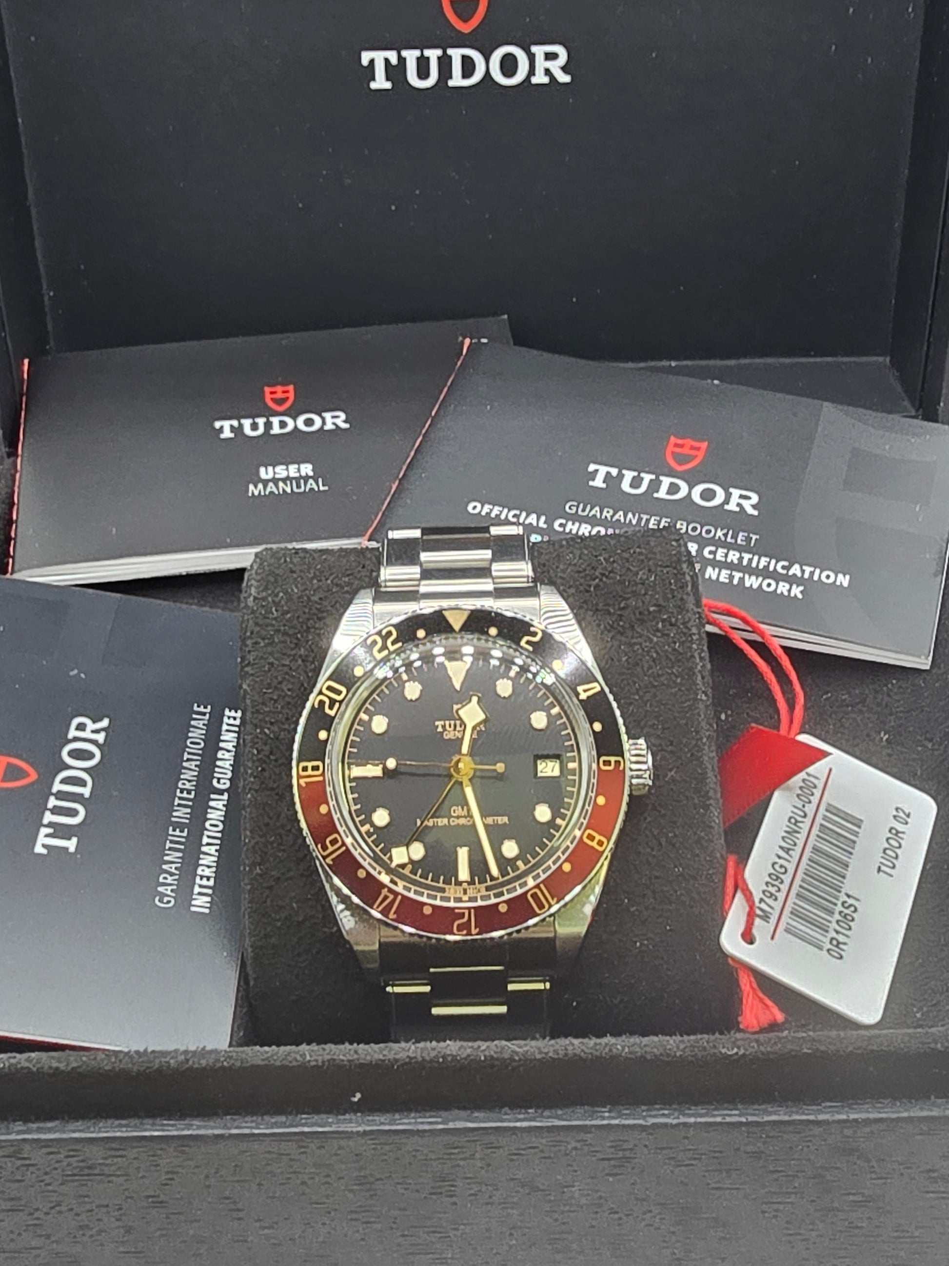 Tudor Black Bay 58 GMT Coke fullset watch from 2024, featuring a black and red bezel, stainless steel case, and classic design.