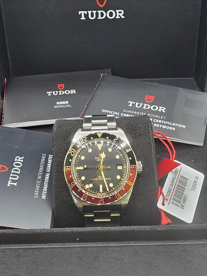 Tudor Black Bay 58 GMT Coke fullset watch from 2024, featuring a black and red bezel, stainless steel case, and classic design.