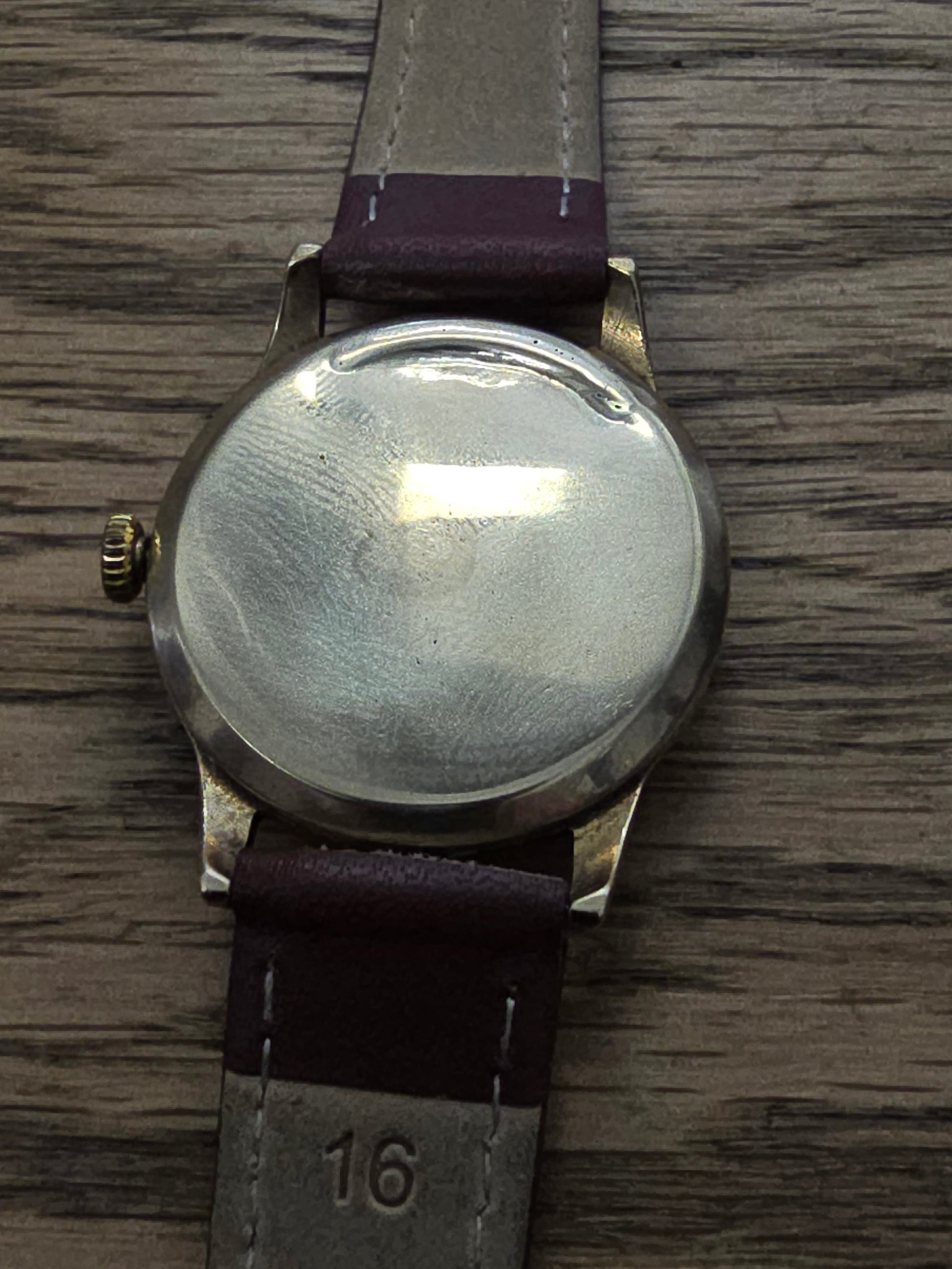 9ct yellow gold Tudor royal watch with brown leather strap, featuring a classic round dial and elegant design.