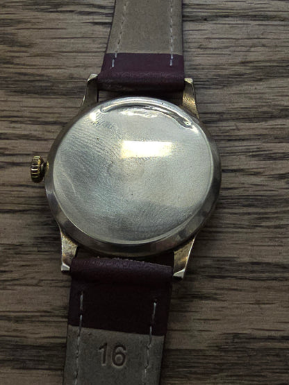 9ct yellow gold Tudor royal watch with brown leather strap, featuring a classic round dial and elegant design.
