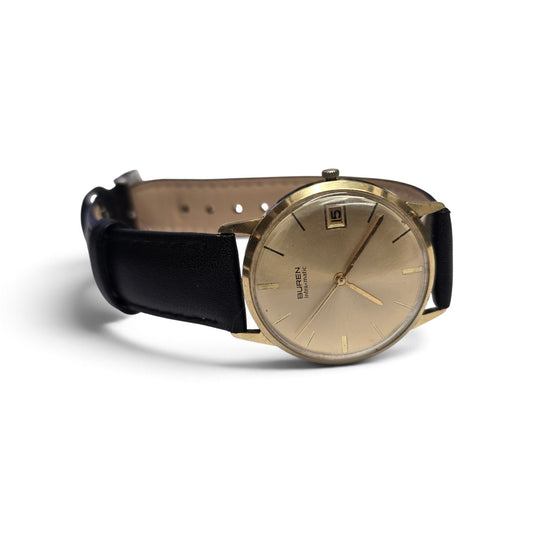 Reeves and Sons vintage Buren Intra-Matic automatic men's watch with gold plating, sunburst dial, and date display.