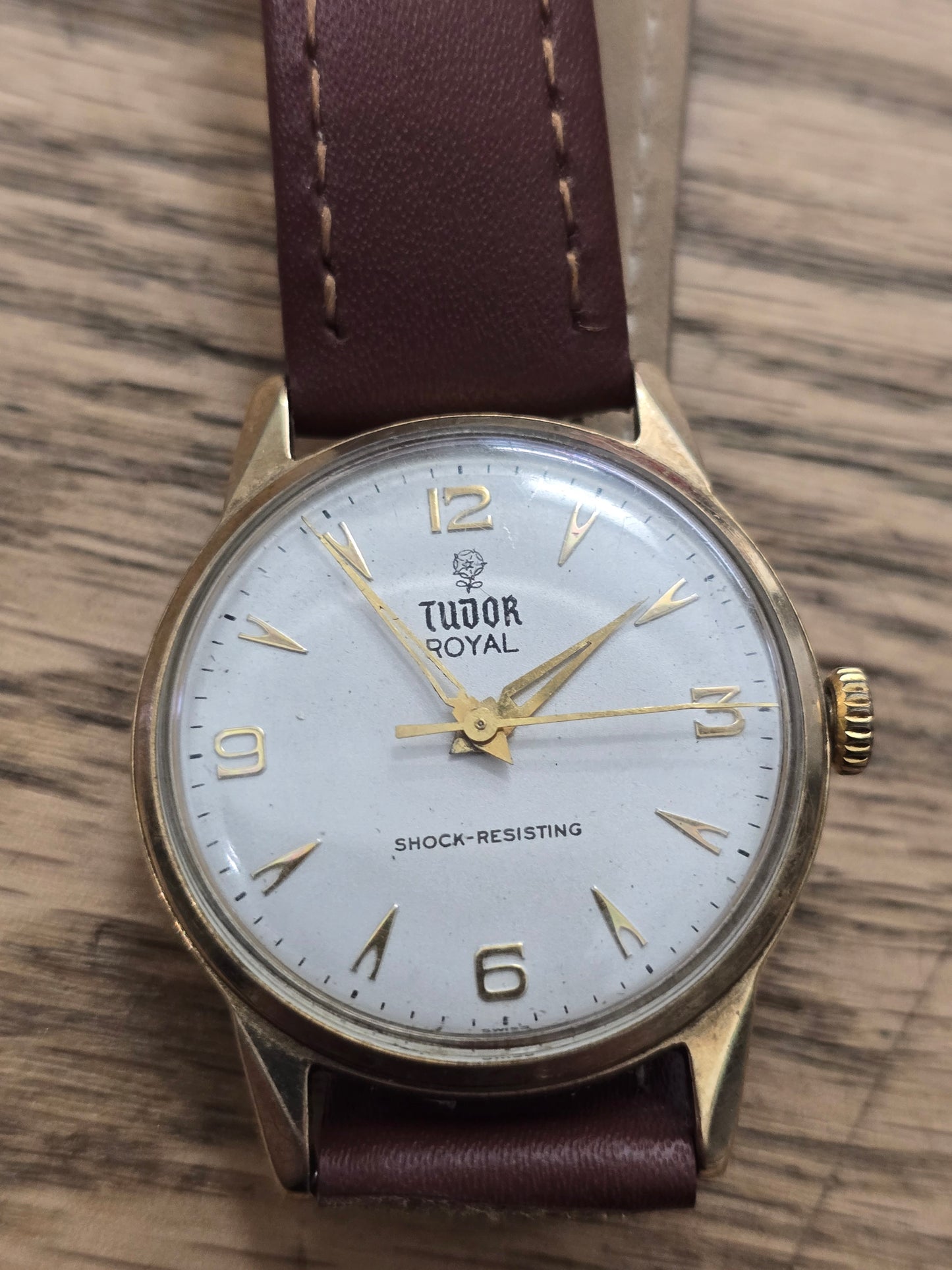 9ct yellow gold Tudor Royal watch with brown leather strap, elegant timepiece by Reeves and Sons.