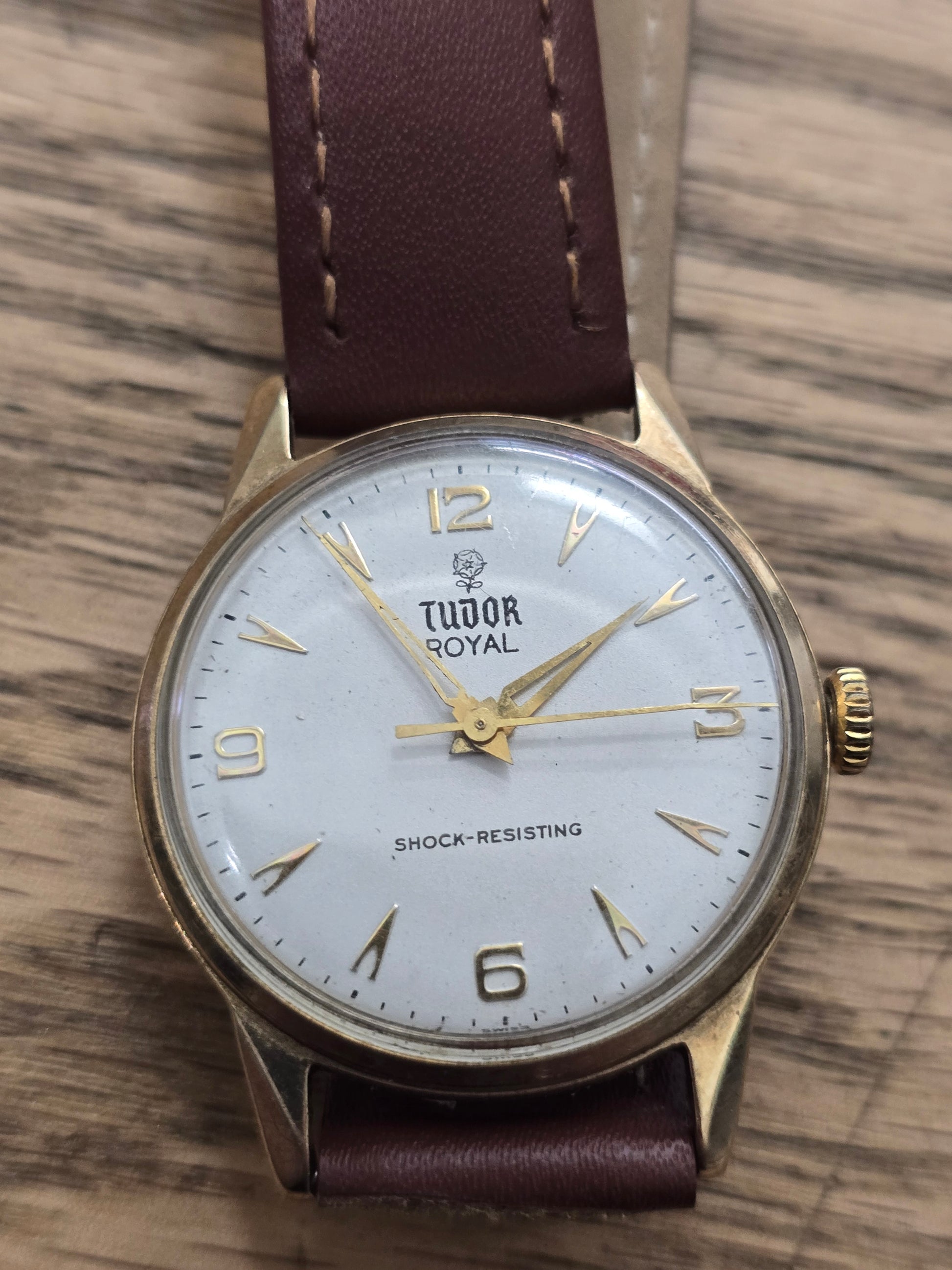 9ct yellow gold Tudor Royal watch with brown leather strap, elegant timepiece by Reeves and Sons.