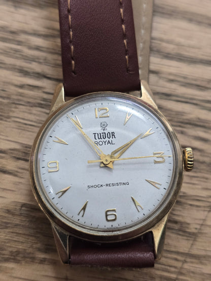 9ct yellow gold Tudor Royal watch with brown leather strap, elegant timepiece by Reeves and Sons.