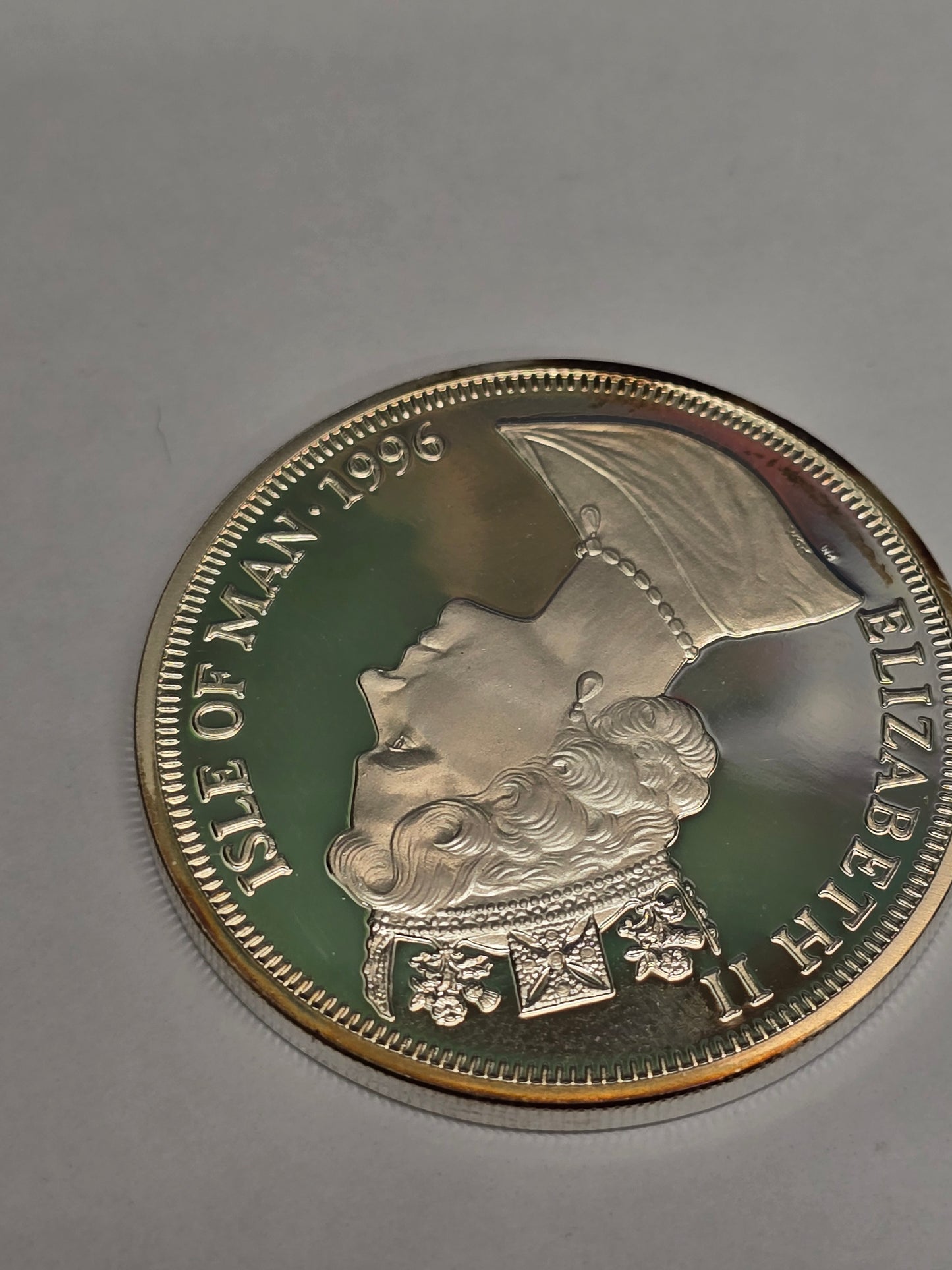 Silver King Arthur coin featuring a one crown legend, minted by Reeves and Sons, with detailed historic design.