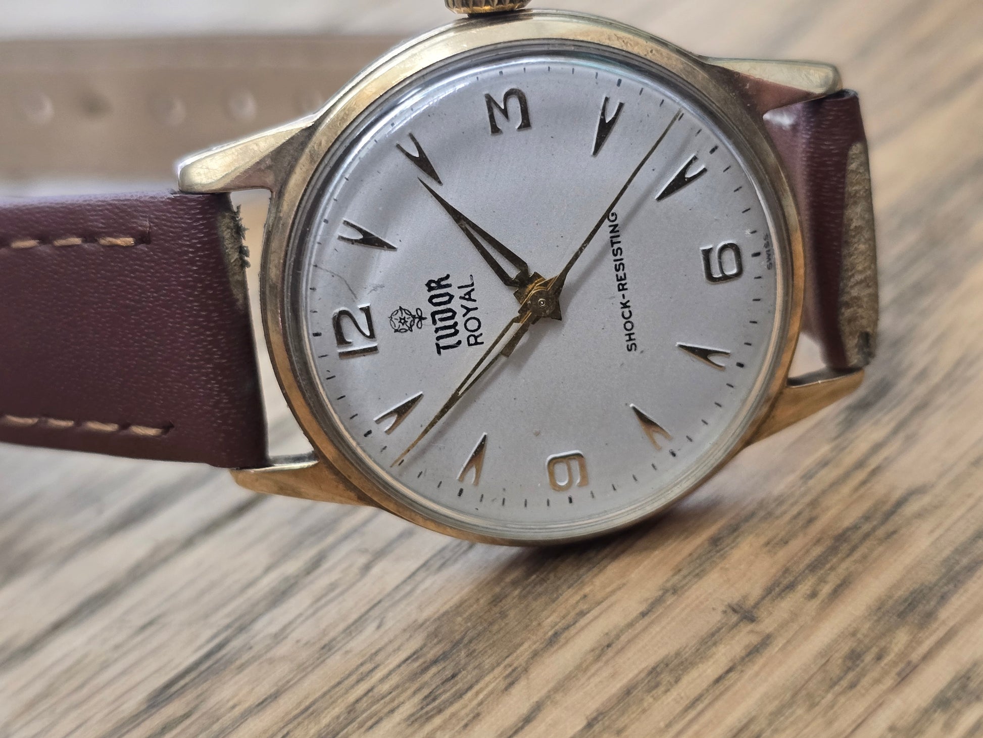 9ct yellow gold Tudor royal watch with brown leather strap, showcasing a classic and elegant timepiece from Reeves and Sons.