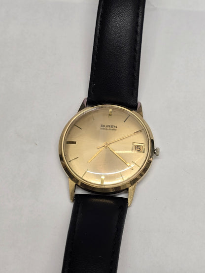 Reeves and Sons Vintage Buren Intra-Matic automatic men's watch with gold plating, sunburst dial, and date display.