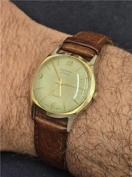 9ct yellow gold Rotary watch with a classic round face and elegant design, showcasing a luxurious timepiece for men or women.