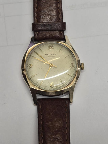 9ct yellow gold Rotary watch with a classic round face and elegant design, showcasing the luxury and craftsmanship of the brand.