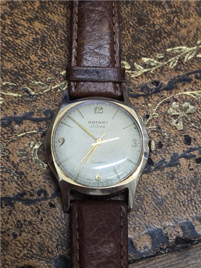 9ct yellow gold Rotary watch with a round dial, classic design, and gold-tone bracelet, displayed on a plain background.